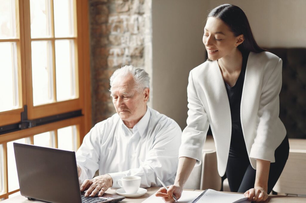 colleagues working together in light modern workspace